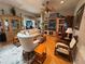 Comfortable living room with hardwood floors, a ceiling fan, and stylish decor at 1512 Nueva Pl, The Villages, FL 32159