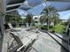 Spacious screened patio for outdoor relaxation and enjoyment of the beautiful landscaped surroundings at 1512 Nueva Pl, The Villages, FL 32159