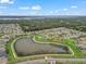 Areal view of neighborhood with a large pond and a home highlighted in red at 17108 Se 111Th Terrace Rd, Summerfield, FL 34491