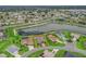 Aerial view highlighting the property location within a community, next to a picturesque lake at 17108 Se 111Th Terrace Rd, Summerfield, FL 34491