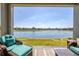 Enjoy this gorgeous view of the lake from the comfort of your back patio seating at 17108 Se 111Th Terrace Rd, Summerfield, FL 34491