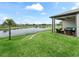 Beautiful backyard with covered patio and gorgeous water view at 17108 Se 111Th Terrace Rd, Summerfield, FL 34491