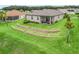 Spacious backyard with a terrace and lush lawn at 17108 Se 111Th Terrace Rd, Summerfield, FL 34491