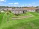 Aerial view showcasing the backyard with its landscaping, terrace, and patio at 17108 Se 111Th Terrace Rd, Summerfield, FL 34491