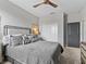 Stylish bedroom featuring a modern ceiling fan and closet space at 17108 Se 111Th Terrace Rd, Summerfield, FL 34491