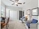 Comfortable bedroom featuring a ceiling fan, a window with blinds, and closet at 17108 Se 111Th Terrace Rd, Summerfield, FL 34491