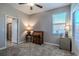 Bedroom featuring natural light, a ceiling fan, and a bonus room for storage or recreation at 17108 Se 111Th Terrace Rd, Summerfield, FL 34491