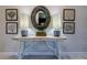 Modern entryway featuring a decorative table, lamps, and artwork for added elegance at 17108 Se 111Th Terrace Rd, Summerfield, FL 34491