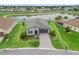 A beautiful single-story home featuring a well-manicured lawn and a paver driveway leads to the garage at 17108 Se 111Th Terrace Rd, Summerfield, FL 34491
