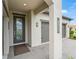Stylish front entry featuring a decorative door and a paved walkway with the address on the pillar at 17108 Se 111Th Terrace Rd, Summerfield, FL 34491