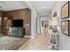 Inviting hallway with tile flooring that leads to the home's living spaces and bedrooms at 17108 Se 111Th Terrace Rd, Summerfield, FL 34491