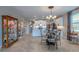 Spacious kitchen open to the living area, featuring white cabinets and stainless steel appliances at 17108 Se 111Th Terrace Rd, Summerfield, FL 34491