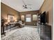 Cozy living room featuring tile floors, natural light and a ceiling fan at 17108 Se 111Th Terrace Rd, Summerfield, FL 34491