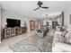 Open-concept living space with a ceiling fan, tile flooring, with a view of the dining and kitchen area at 17108 Se 111Th Terrace Rd, Summerfield, FL 34491