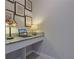 Corner office nook features speckled countertop, laptop, and decorative lamps at 17108 Se 111Th Terrace Rd, Summerfield, FL 34491