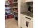 Walk-in pantry with ample shelving for organized storage at 17108 Se 111Th Terrace Rd, Summerfield, FL 34491
