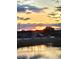 Scenic sunset view reflecting on the water at 17108 Se 111Th Terrace Rd, Summerfield, FL 34491