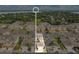 Aerial view of a residential community with well-maintained landscaping and manicured lawns at 17406 Chateau Pine Way, Clermont, FL 34711
