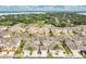 Sprawling community of charming townhomes with well-manicured lawns and access to a scenic lake at 17406 Chateau Pine Way, Clermont, FL 34711