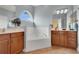 Relaxing bathroom with a large soaking tub, double vanities, and natural light at 17406 Chateau Pine Way, Clermont, FL 34711