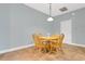 Cozy dining area features a wood table and four chairs, perfect for intimate meals at 17406 Chateau Pine Way, Clermont, FL 34711