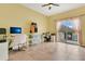 Bright office with a sliding glass door to a private balcony, maximizing natural light at 17406 Chateau Pine Way, Clermont, FL 34711