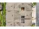 Aerial view of a well-maintained roof with skylights and screen enclosed patio at 17406 Chateau Pine Way, Clermont, FL 34711