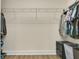 Walk-in closet with hanging rods, a small drawer, and ample storage space at 17406 Chateau Pine Way, Clermont, FL 34711