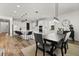 Open dining area with views of the kitchen and modern decor at 17700 Sawgrass Run, Tavares, FL 32778