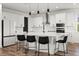 Spacious kitchen boasts a large island, stainless steel appliances, and ample counter space at 17700 Sawgrass Run, Tavares, FL 32778