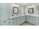 Elegant bathroom featuring double sink vanity with ample cabinet space at 2077 Vickers Pl, The Villages, FL 32163