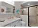 Beautiful bathroom with shower featuring glass doors and granite countertop at 2077 Vickers Pl, The Villages, FL 32163