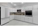 Modern kitchen featuring white cabinets, stainless steel appliances, and granite countertops at 2077 Vickers Pl, The Villages, FL 32163