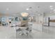 Open-concept living space seamlessly connects the dining area, kitchen island, and living room at 2077 Vickers Pl, The Villages, FL 32163