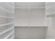 Walk-in closet featuring ample shelving and storage space at 2082 Vision Ct, The Villages, FL 32163