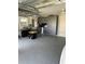 Garage with large storage cabinets, sink, and plenty of space at 2082 Vision Ct, The Villages, FL 32163