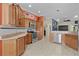 Well-equipped kitchen with stainless steel appliances, wood cabinetry, and ample counter space at 2082 Vision Ct, The Villages, FL 32163