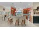 Well-lit kitchen with a breakfast bar, stainless steel appliances, and seamless access to dining area at 2082 Vision Ct, The Villages, FL 32163