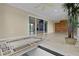 Open sunroom featuring tiled floors, a ceiling fan, access to the backyard and ample sunlight at 2082 Vision Ct, The Villages, FL 32163