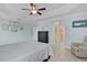 Bright and airy main bedroom with an ensuite bathroom, tile floors, and ample closet space at 2082 Vision Ct, The Villages, FL 32163