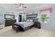 Serene main bedroom with stylish furnishings, tray ceiling, and tranquil decor at 2082 Vision Ct, The Villages, FL 32163