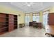Bright office space with tiled floors, bookshelves, and a desk at 2082 Vision Ct, The Villages, FL 32163