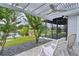 Outdoor patio with white pergola and furniture overlooking pond at 2082 Vision Ct, The Villages, FL 32163