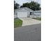 Charming single-story home with a two-car garage and white picket fence at 2105 Escobar Ave, The Villages, FL 32159