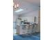 Bright kitchen with a vaulted ceiling, skylight, and breakfast bar with seating at 2105 Escobar Ave, The Villages, FL 32159