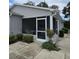Cozy screened porch with seating, ideal for enjoying the outdoors in comfort at 2105 Escobar Ave, The Villages, FL 32159