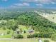 Scenic aerial view of the property and surrounding farmland at 21320 Paradise Way, Eustis, FL 32736
