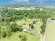 Aerial view featuring the home and surrounding farmland at 21320 Paradise Way, Eustis, FL 32736