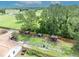 Close aerial view of kennels adjacent to the house at 21320 Paradise Way, Eustis, FL 32736