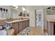 Bathroom featuring double sinks, ceramic tile, and backyard access at 21320 Paradise Way, Eustis, FL 32736